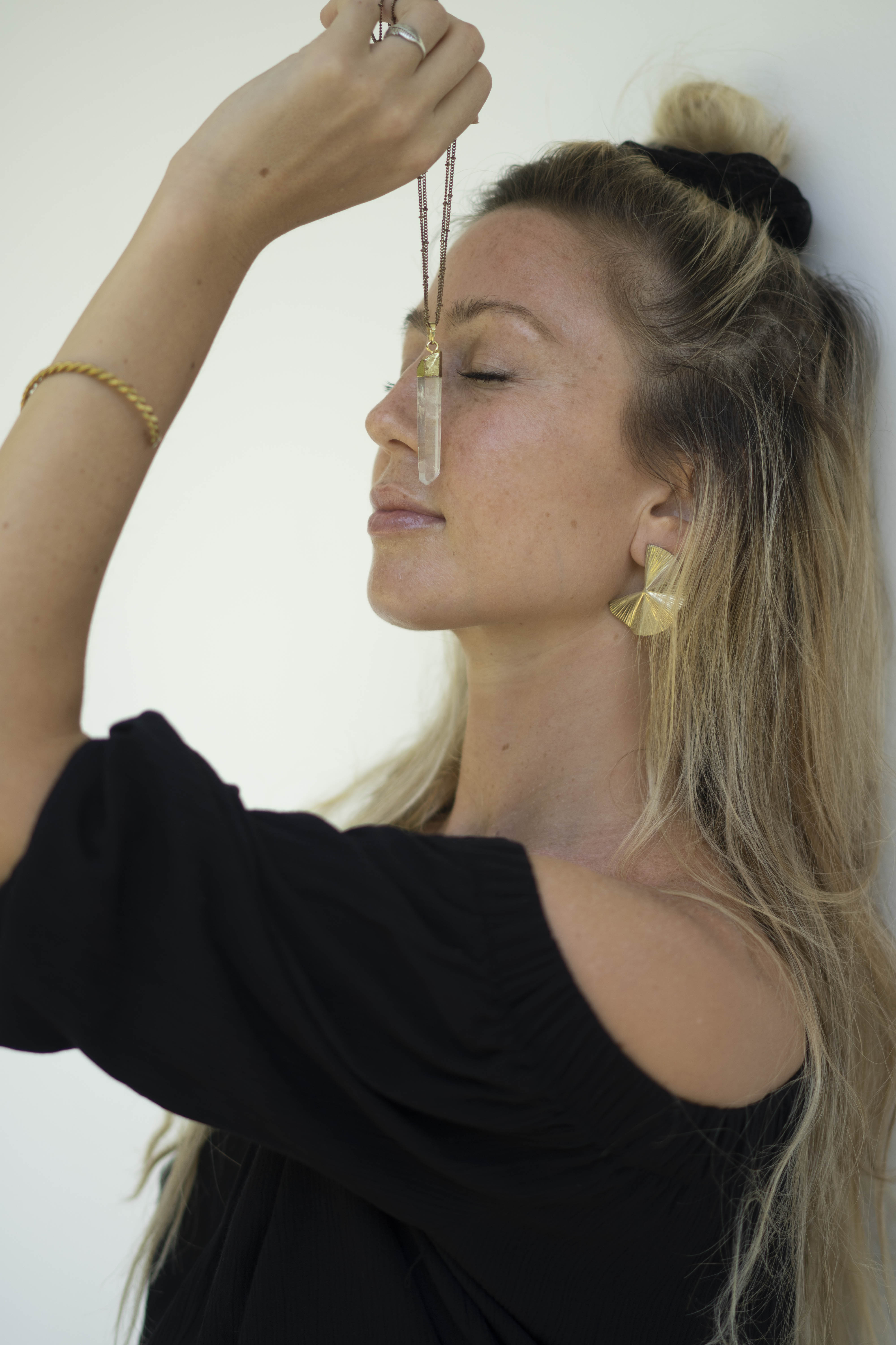 Chakra Mapping — Tania Ginard with crystal pendulum